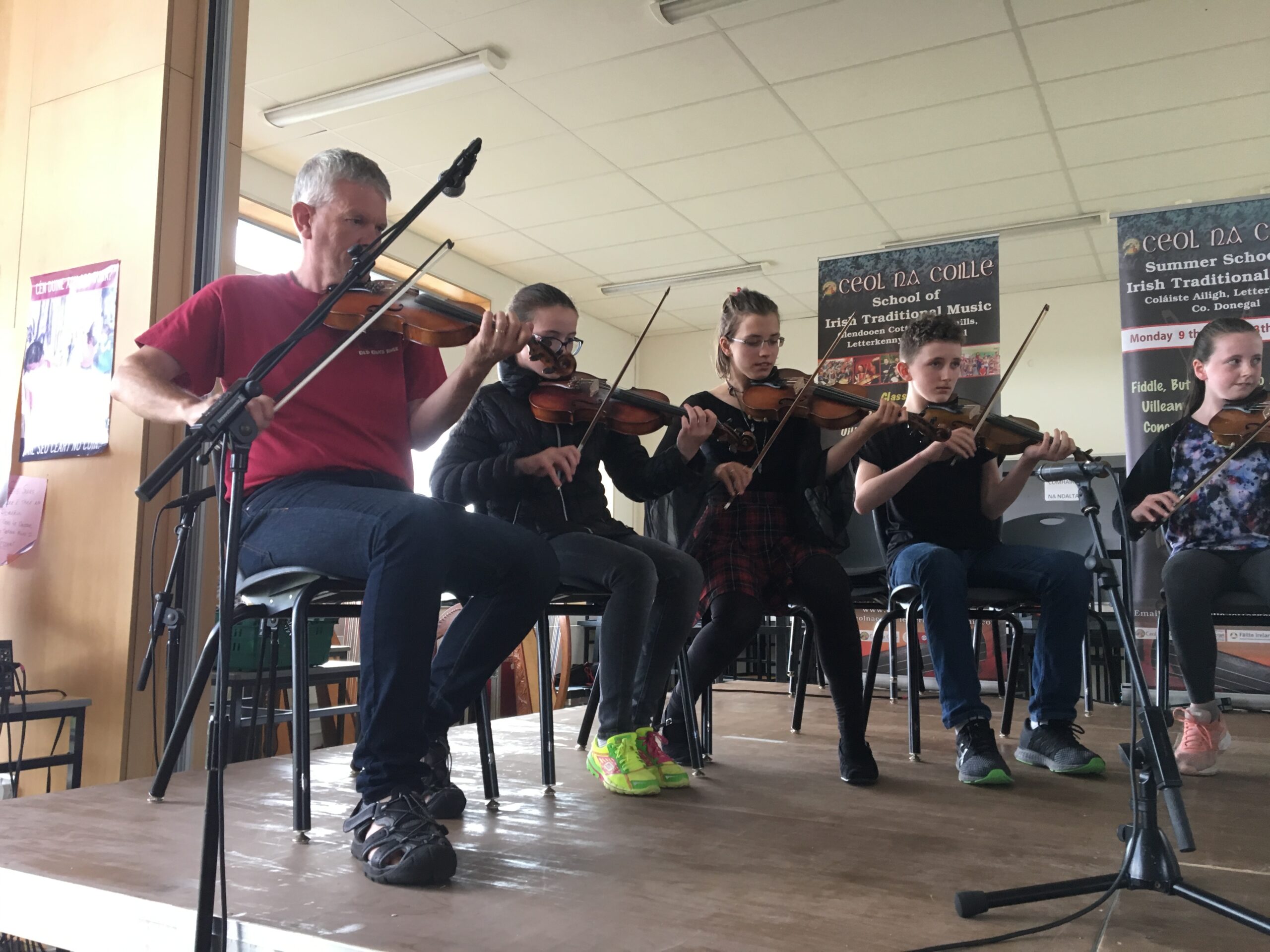 Paul O’Shaughnessy with some of his fiddle class Ceol na Coille Summer School 2018